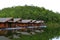 Wooden houses floating on river for tourist take rest and chill out among beauty of nature with green mountain