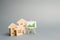 Wooden houses with a stand of graphics and information. Growing demand for housing and real estate. growth of the city and its