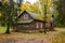 Wooden houses surrounded by maple trees