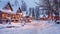 Wooden houses in the village in winter at night. Beautiful winter landscape