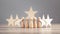 Wooden human figures with stars. Best customer evaluation and satisfaction