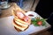 Wooden Human Manikin eating a delicious pancakes with bacon, in a restaurant