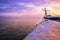 Wooden Human Manikin posing on a beach with a beautiful sunset from a view point on a beach in Mossel Bay