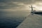 Wooden Human Manikin posing on a beach with a beautiful sunset from a view point on a beach in Mossel Bay