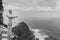 Wooden Human Manikin posing looking over a Beautiful view of the cliffs at Cape point at Cape Point Nature Reserve, Cape Point