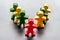 A wooden human red figure stands out from the crowd. Leadership, team building, business succes concept