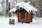 Wooden hut covered with snow in the winter forest. Hut on chicken legs. Baba Yaga house. Deer Streams nature park. Ural, Russia