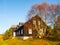 Wooden hut in Jizerka village. Sunny autumn day. Jizera Mountains, Czech Republic