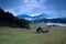 Wooden hut and morning fog over Geroldsee lake