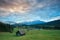 Wooden hut o meadow by Geroldsee lake at sunrise