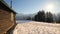 Wooden hut with shutters and narrow chimney in the snow