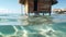 Wooden hut in water on tropical island