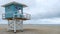 Wooden hut white blue colors on stilts of the lifeguards on sand beach of deauville in france