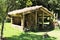 Wooden hut with wooden chairs under the straw roof in the countryside Madeira, Portugal