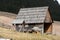 Wooden huts in Chocholowska valley in spring, Tatra Mountains,