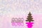 Wooden icon with 2020 digits and green Christmas tree on white glitter sparkling and pink background with bokeh