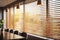 Wooden jalousie grace office windows, lighting range adjusted for meetings