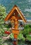 Wooden Jesus Christ on a tombstone, Gosau, Austria