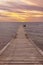 Wooden jetty at the Baltic Sea in sunset