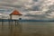 Wooden jetty and boathouse on Lake Weissensee, Carinthia, Austria under cloudy sky