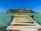 A wooden jetty at the edge of the turquoise lagoon at Balos Beach, Crete on a bright sunny day