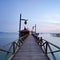 wooden jetty on mabul island looking across the ocean to sipadan