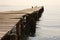 Wooden jetty in morning sunlight, Ipsos, Corfu