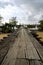 Wooden jetty over cloudy sky