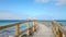 Wooden jetty into turquoise, green Indian Ocean