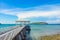 wooden jetty walkway with pavillion to the sea