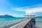 wooden jetty walkway with pavillion to the sea