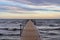 Wooden jetty in the wavy Baltic Sea