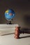 Wooden Judge gavel and globe. International environment law concept. Vertical image
