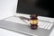 Wooden judge gavel on a silver laptop computer, cyber law or online auction concept.