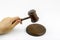 A wooden judge gavel and soundboard isolated