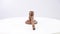 Wooden judge's gavel spinning on a white background.