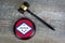 Wooden judgement or auction mallet with of Arkansas flag.