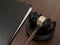 Wooden judges gavel and leather folder on the brown wooden background