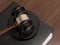 Wooden judges gavel and leather folder on the brown wooden background