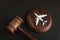 Wooden Judges gavel and toy plane. Aviation Law. To sue the airline