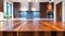 Wooden kitchen counter, tabletop, blurred defocused dining interior background AI generated