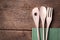 Wooden kitchen cutlery on wooden background