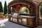 Wooden kitchen with a table and chairs in the summer garden, front view outside BBQ area, arched gazebo, stainless steel BBQ,
