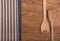 Wooden kitchen utensils and linen kitchen towels