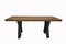 wooden lacquered table with black legs on white background standing side view