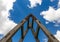 Wooden ladder with metal fittings against perfect blue sky