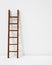 Wooden ladder with shadow on white background