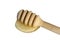 A wooden ladle with honey lies on a white isolated background.