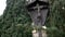 Wooden landmark with Christ crucified on cross. Art. View of wooden monument of crucified Jesus Christ standing between