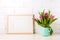 Wooden landscape frame mockup with pink tulips in jug